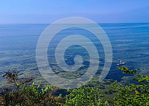 Swimming on SUP board on Pucka Bay. Poland photo