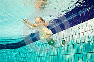 Swimming under the water girl with flower