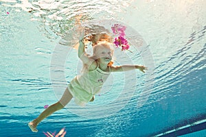 Swimming under the water girl with flower