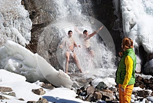 Swimming in winter waterfall