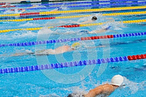 Swimming: A young athletes is swimming in Butterfly Stroke in a