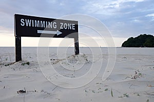 Swimming zone sign on beach