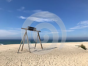 Swing at the beach of Poco da Cruz near Mira, Portugal photo