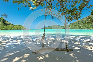 Swing and Beautiful beach for relaxation, Located Surin Island, photo