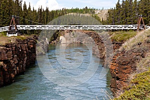 Swing bridge across Miles Canyon of Yukon River