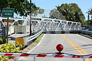 Swing bridge moves out of the way for a boat to get by.