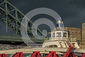 Swing Bridge and Tyne bridge against with cloudy sky on a stormy evening in Newcastle, UK