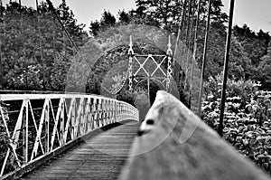 Swing bridge at victoria park in black and white.