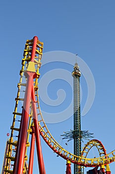 Swing carousel and roller coaster ride at amusement park