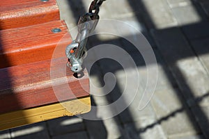 Swing on chains in the city park. children`s playground