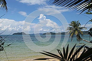 Swing or cradle hang on coconut tree beautiful nuture blue sky and shadow at koh Mak beach Trad Thailand