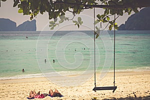 Swing hang from coconut tree over beach, Phi Phi Island, Thailan