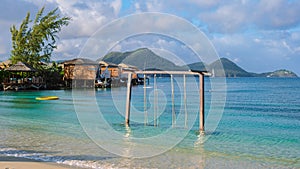 Swing in the ocean on the Beach of the tropical Island Saint Lucia or St Lucia Caribbean