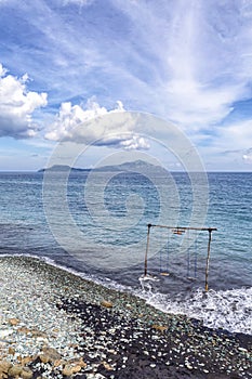 Swing in the ocean photo