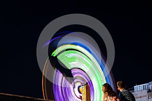 Swing in the parks in motion at night in Ukraine in the park