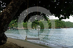 Swing at Parlatuvier Bay beach on the tropical Caribean island of Tobago