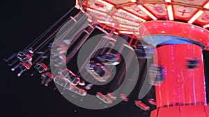 Swing ride funfair fairground ride carousel merry go round  copy space night fun entertainment rotate spinning turn stock, footage