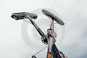 Swing ride going around at a fair. entertainment amusement park