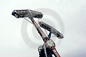 Swing ride going around at a fair. entertainment amusement park