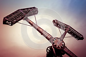 Swing ride going around at a fair. entertainment amusement park