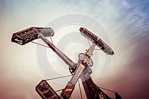 Swing ride going around at a fair. entertainment amusement park