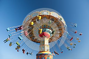 Swing rides at the amusement park photo