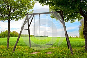 Swing seat in a summer field