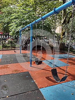 Swing Set In An Urban Park, NYC, NY, USA