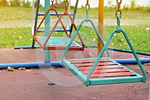 Swing steel seat in playground for kid playing in outdoor