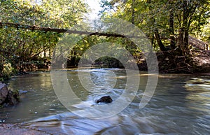 Swinging Bridge Spanning a Creek