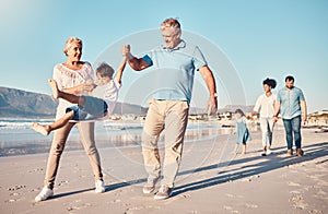 Swinging, grandparents and a child walking on the beach on a family vacation, holiday or adventure in summer. Young boy