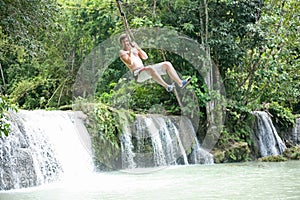 Swinging out terrified at the Cambugahay Falls on Siquijor Island, the Philippines