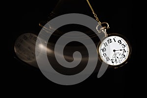 Swinging Pocket Watch Beckoning You to Look More Closely