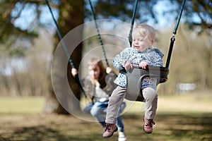 Swinging sisters having fun