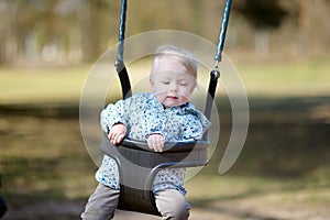 Swinging toddler having fun