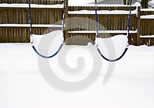Swings Covered with Snow