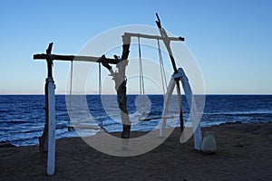 Swings on the shores of the Red Sea in the Gulf of Aqaba. Dahab, South Sinai Governorate, Egypt