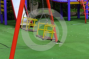 Swings and slides in the park for children. Children& x27;s playgroun
