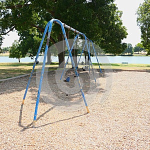 Swingset at a City Park Playground photo