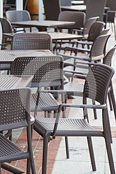 Swinoujscie, West Pomeranian - Poland - June 16, 2021: Plastic chairs and tables on fresh air in outdoor restaurant or cafe in