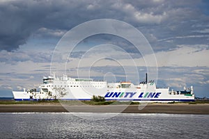 Swinoujscie, West Pomeranian - Poland - June 7, 2022: Wolin ferry leaving port of Swinoujscie and sailing to Ystad. Transport