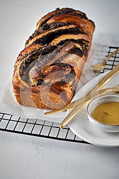 Swirl brioche with poppy seeds. Easter bread. Poppy seed braided or roll bread, Babka. Traditional Polish sweet