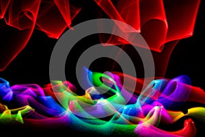 Swirl of colored lights against black background