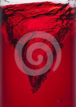 Swirl of red liquid small typhoon