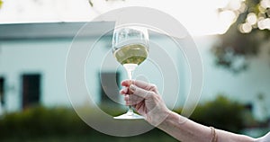 Swirl, wine and person with glass in hand for luxury alcohol experience or drink at sunset on farm. Vineyard, testing