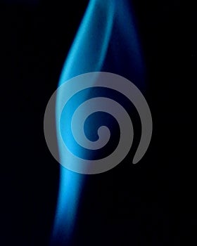 Swirling blue smoke on a black background