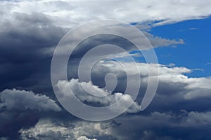 Swirling evening clouds illuminated by the setting sun