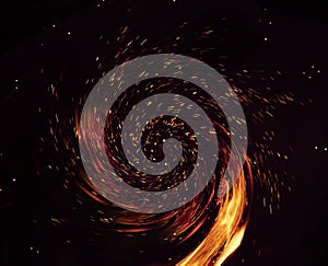 swirling fire sparks from burning fire