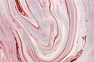 Swirls of marble or the ripples of agate. Liquid marble texture with pink and brown colors. Abstract painting background