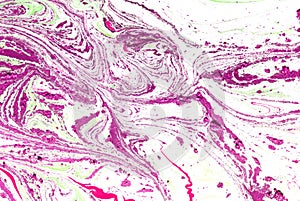 Swirls of marble or the ripples of agate. Liquid marble texture with pink and brown colors. Abstract painting background.